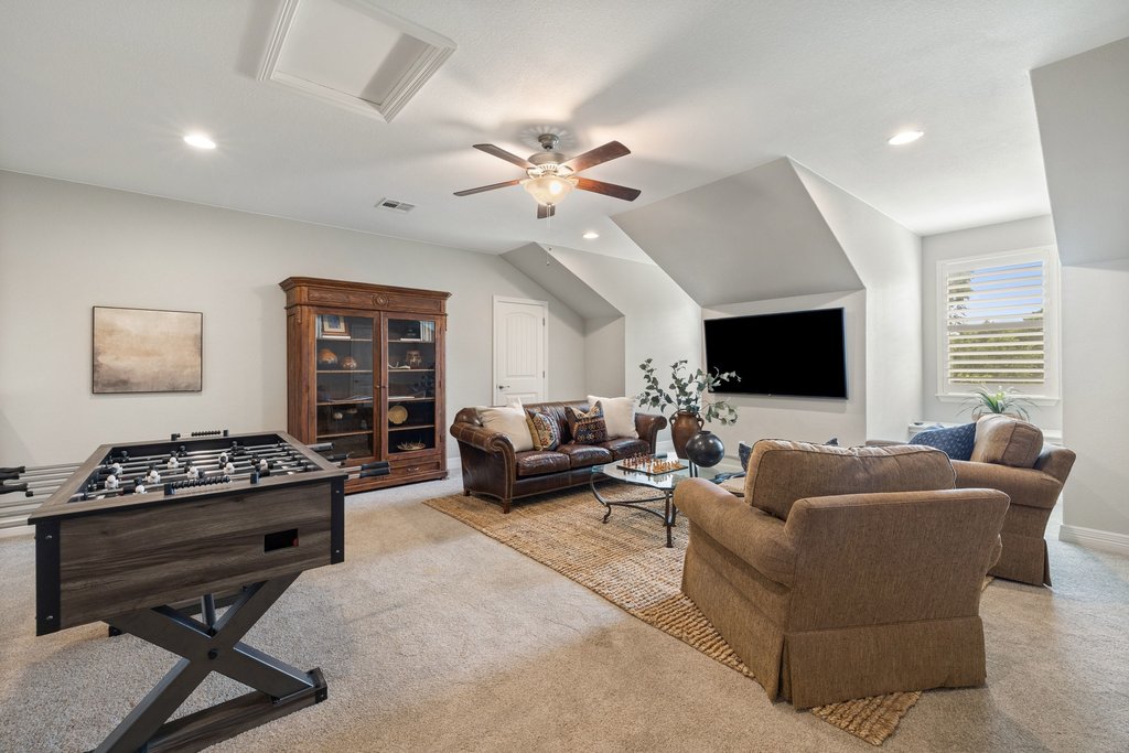 108 Berry Cove Georgetown, TX 78628 - Photo 30 of 39 a living room with furniture and a flat screen tv