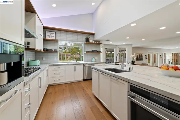a kitchen with a stove and a refrigerator