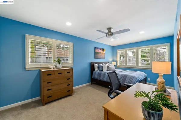 an aerial view of a house with a yard basket ball court and outdoor seating