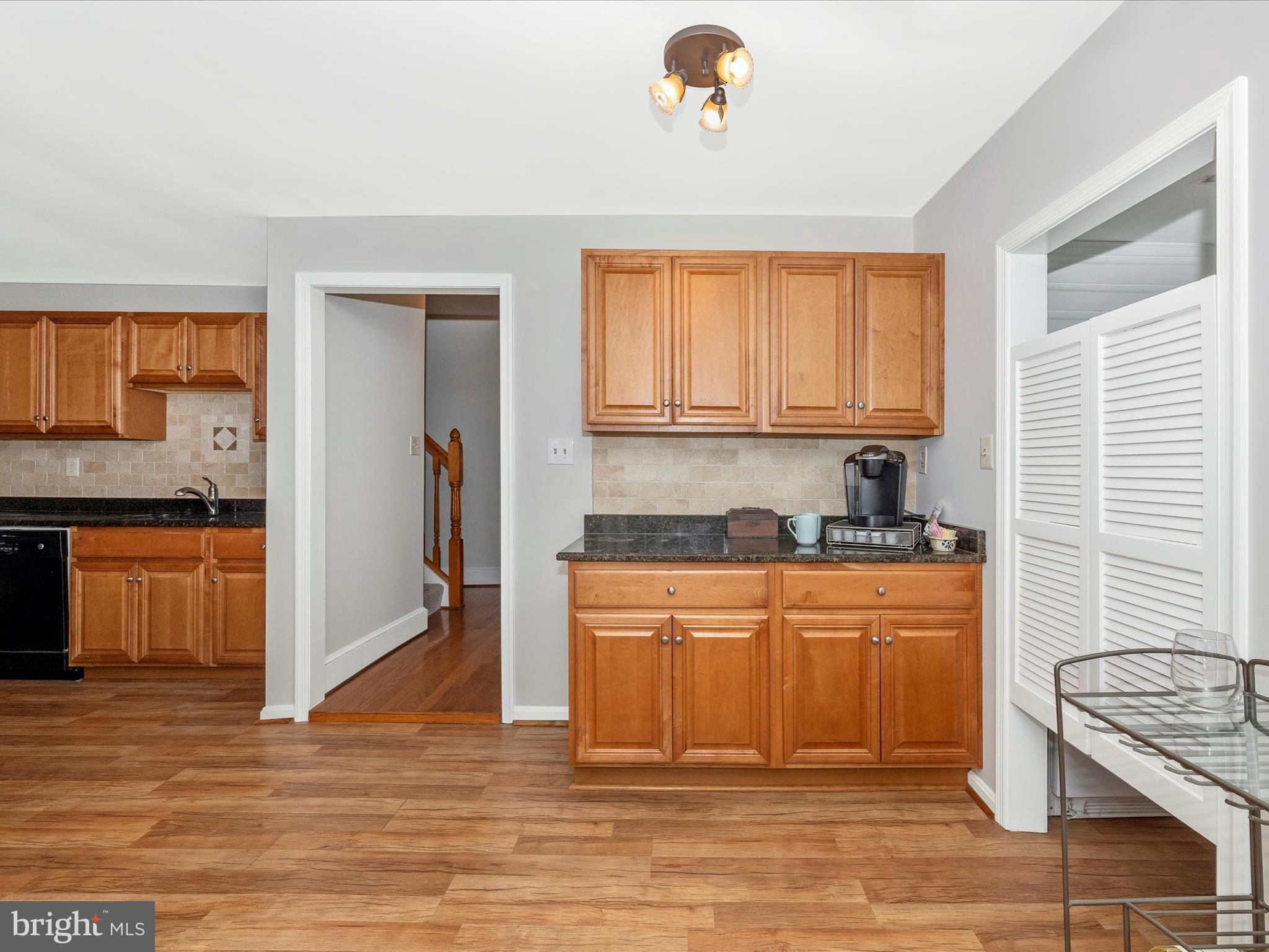 15920 Barnesville Road Boyds, MD 20841 - Photo 20 of 57 a kitchen with stainless steel appliances granite countertop a stove a sink and a refrigerator