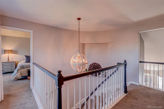 a view of a hallway view with staircase