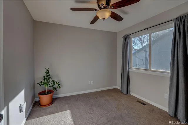 a room with lots of potted plants