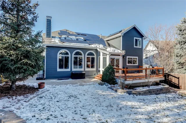 a balcony with view of trees in the background