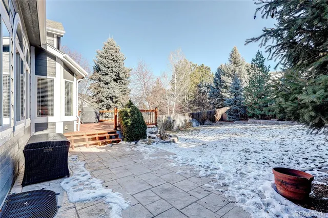 a view of a house with a wooden fence