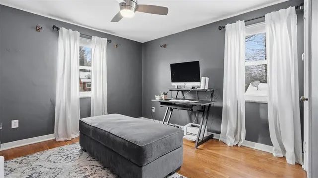 a bedroom with a bed and a desk