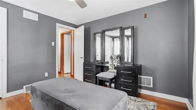 a living room with furniture and large windows