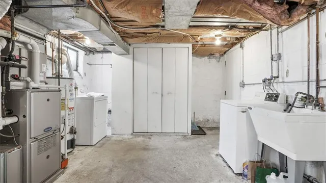 a view of a kitchen with refrigerator and window