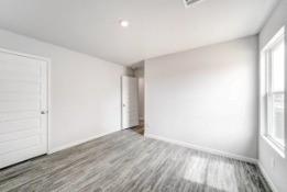332 Azalea Trail Granbury, TX 76048 - Photo 2 of 8 an empty room with wooden floor and windows