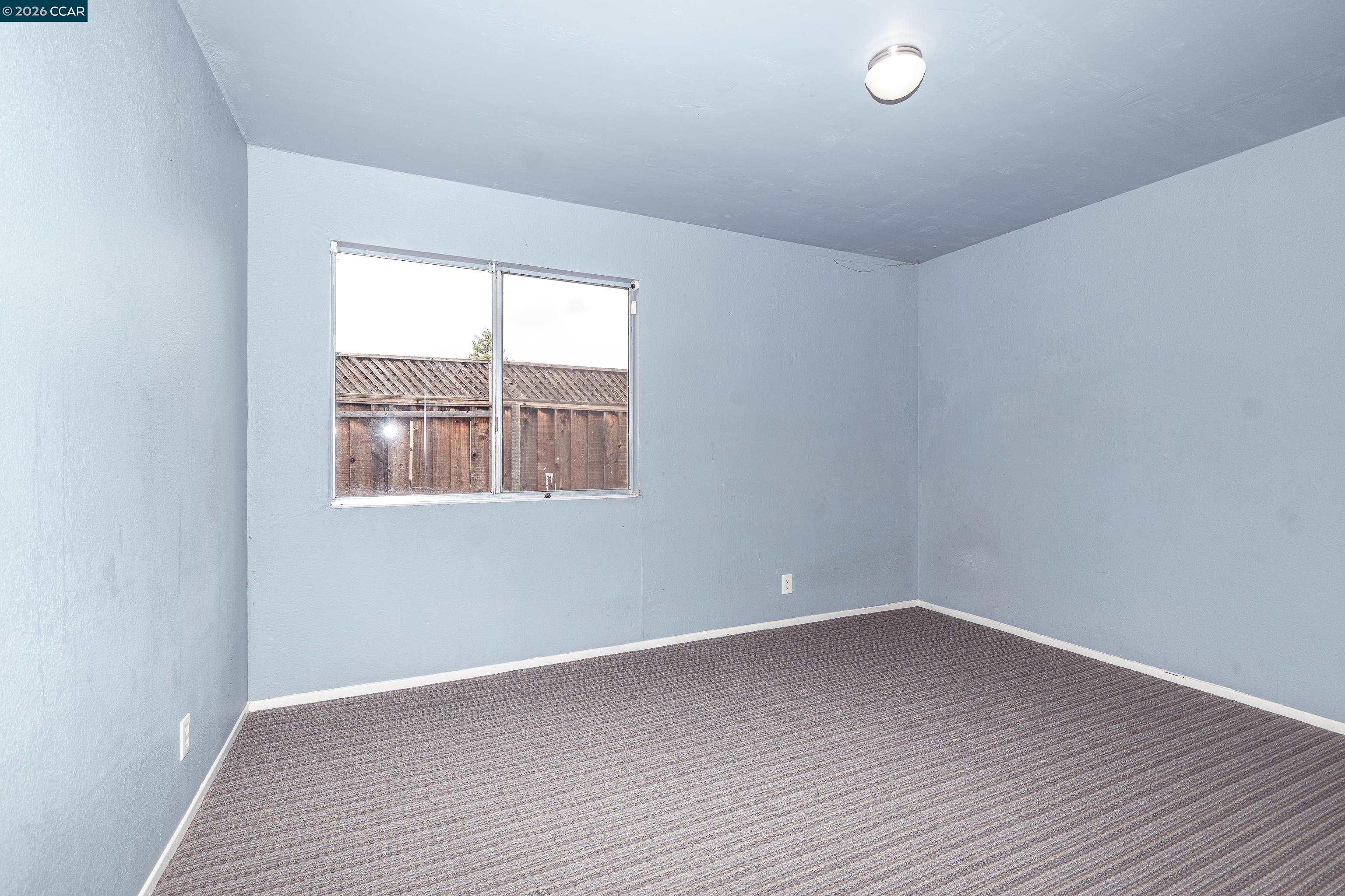 1730 Springwood Way Antioch, CA 94509 - Photo 13 of 24 wooden floor in an empty room with a window