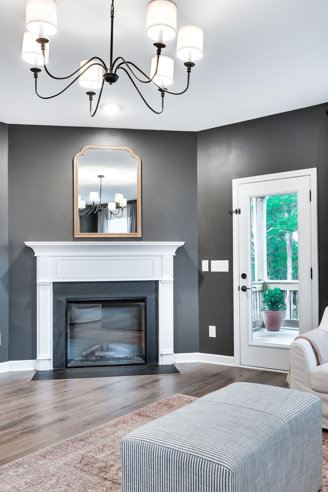 12 Kelly Court Lebanon, TN 37087 - Photo 29 of 55 a bedroom with a fireplace and a chandelier