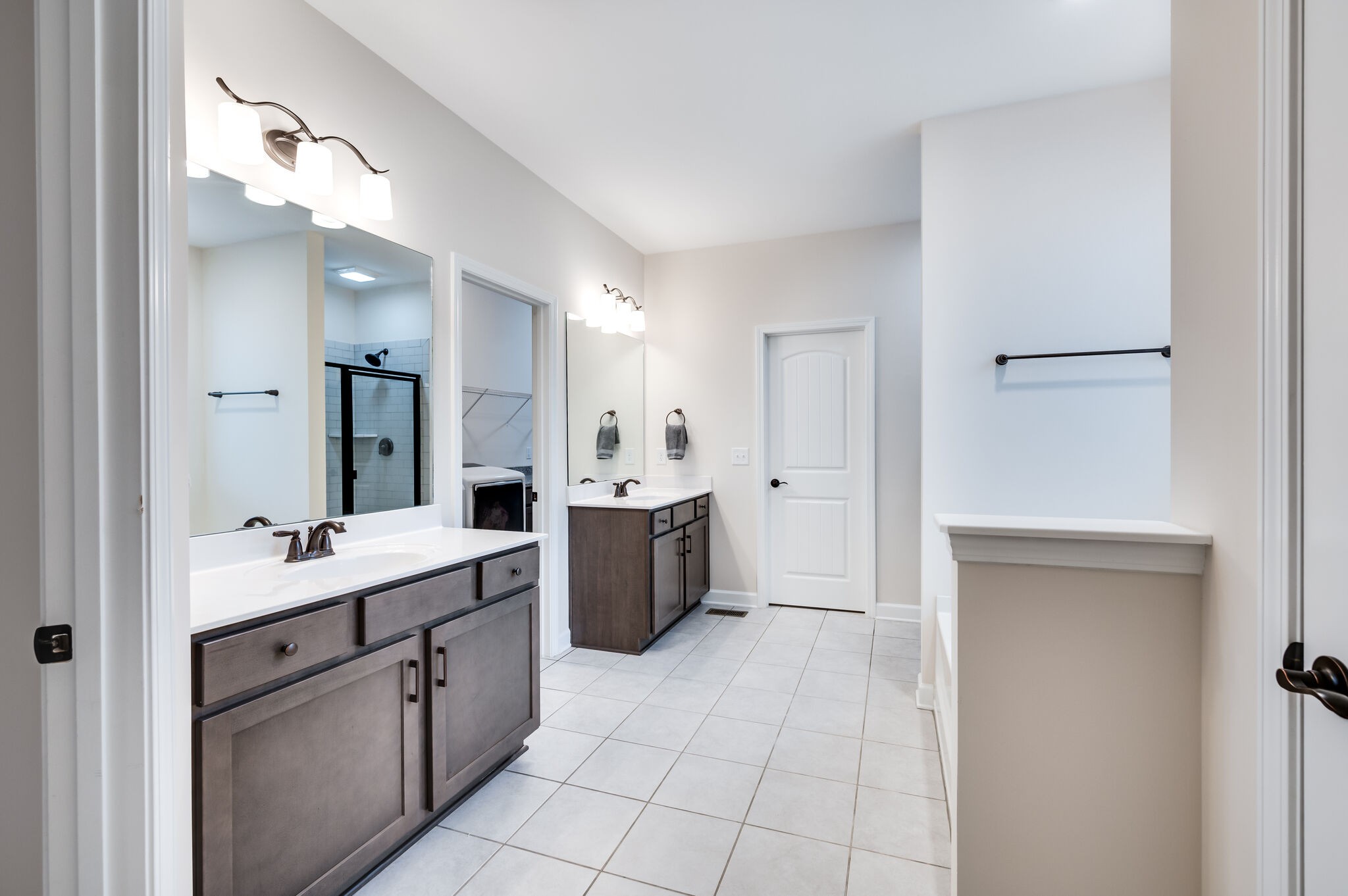 12 Kelly Court Lebanon, TN 37087 - Photo 32 of 55 a large bathroom with a double vanity sink a mirror and a bathtub