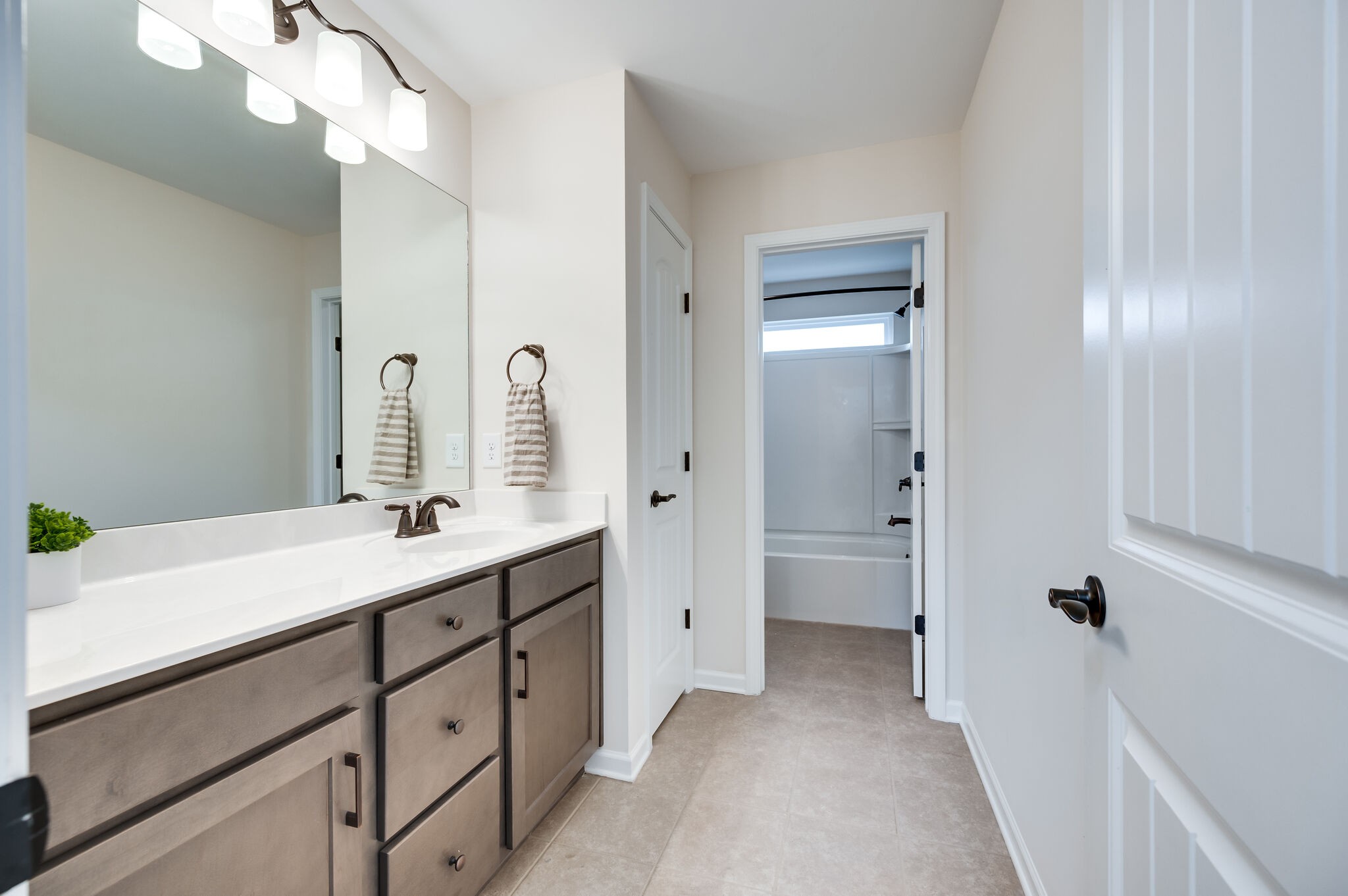 12 Kelly Court Lebanon, TN 37087 - Photo 45 of 55 a en suite bathroom with a double vanity sink a mirror and a shower
