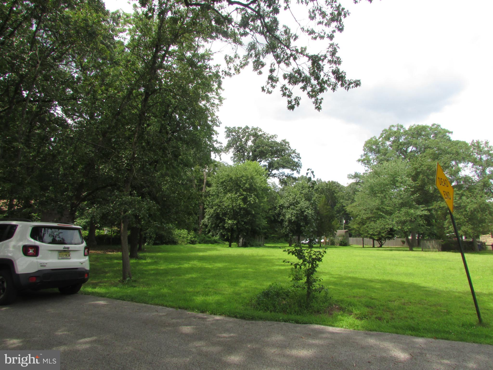 1215 Bridgeboro Road Edgewater Park, NJ 08010 - Photo 12 of 13 a front view of a house with a yard