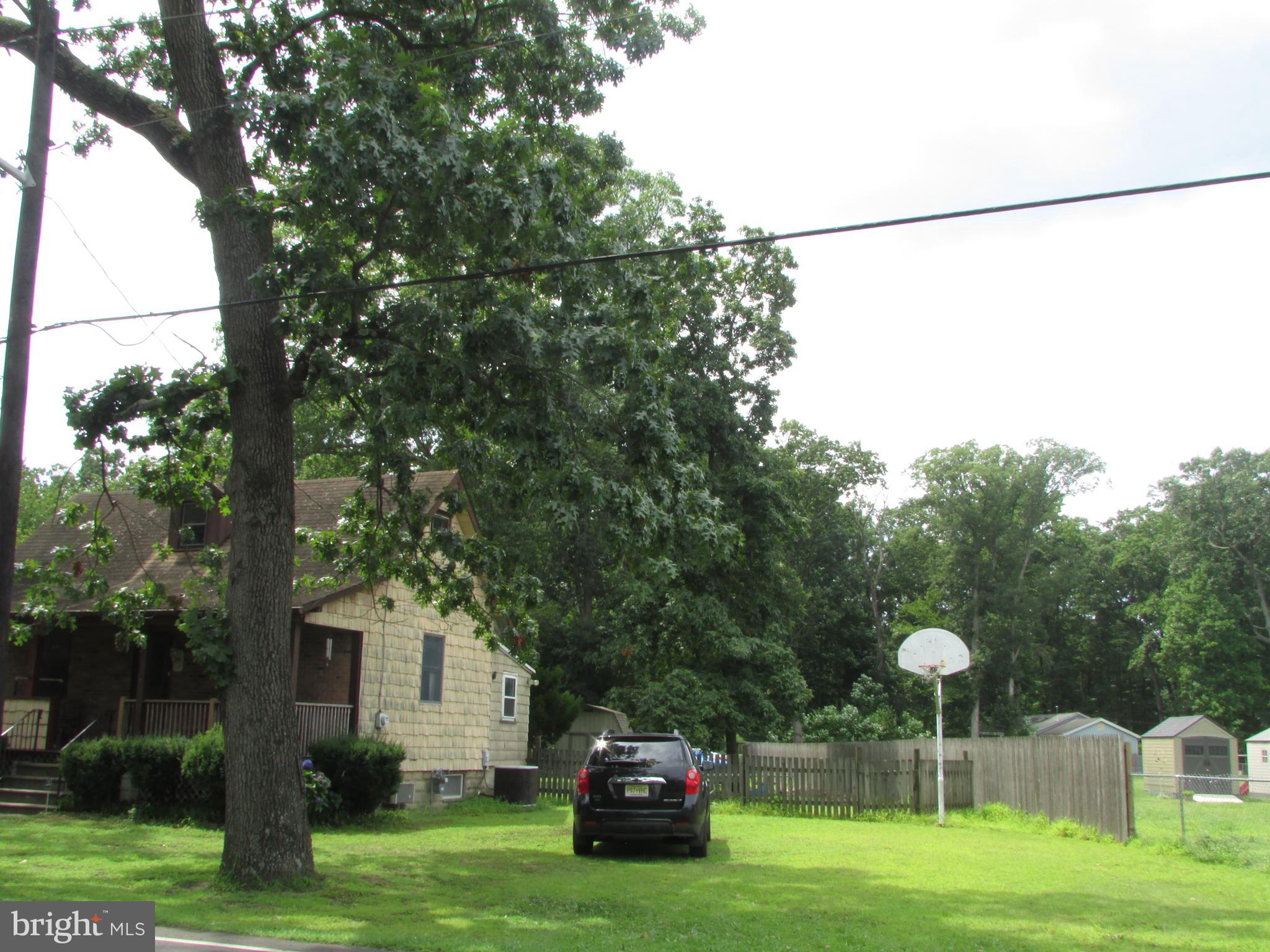 1215 Bridgeboro Road Edgewater Park, NJ 08010 - Photo 3 of 13 a house view with a garden space