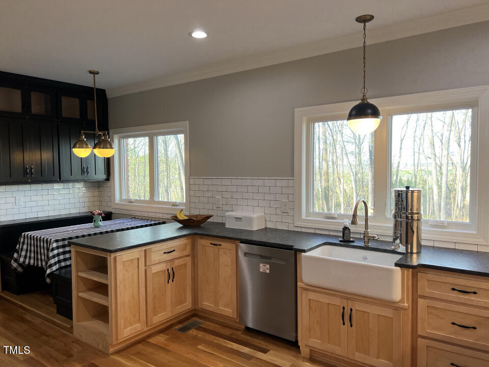 804 Crabtree Glenn Road Rougemont, NC 27572 - Photo 20 of 66 a kitchen with a sink stove and cabinets