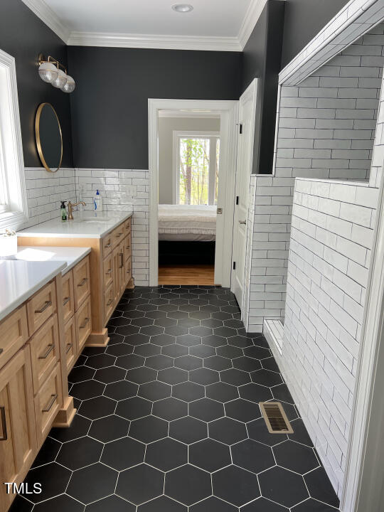 804 Crabtree Glenn Road Rougemont, NC 27572 - Photo 26 of 66 a bathroom with a double vanity sink mirror and bathtub