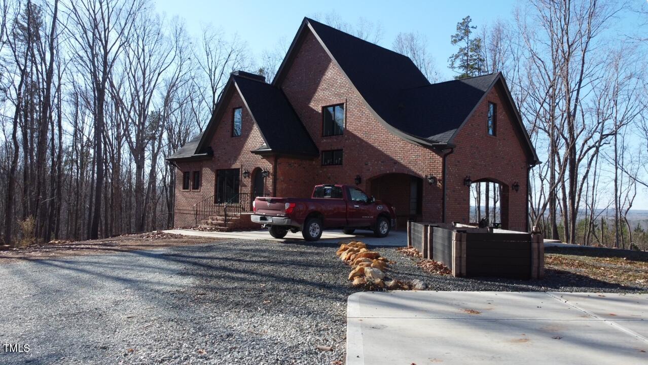804 Crabtree Glenn Road Rougemont, NC 27572 - Photo 3 of 66 a front view of a house with large trees