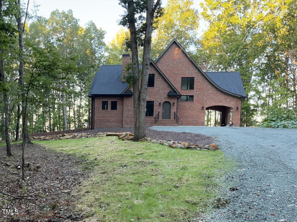 804 Crabtree Glenn Road Rougemont, NC 27572 - Photo 4 of 66 a house that has a tree in front of it
