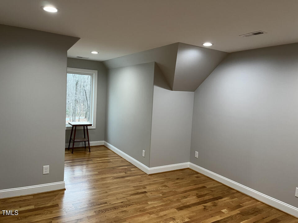 804 Crabtree Glenn Road Rougemont, NC 27572 - Photo 41 of 66 an empty room with wooden floor and a window