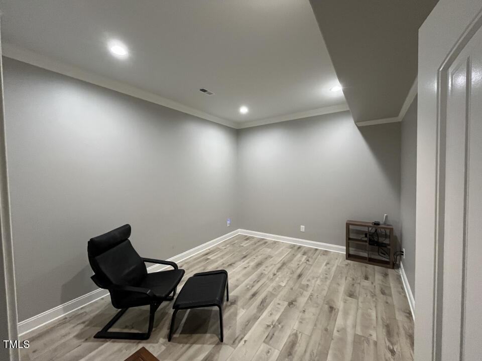 804 Crabtree Glenn Road Rougemont, NC 27572 - Photo 53 of 66 a view of a room with wooden floor and lounge chair