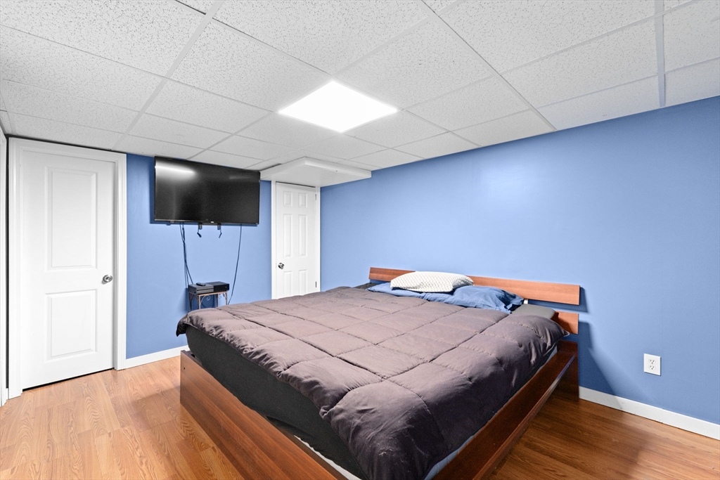40 Cohasset Road Wareham, MA 02532 - Photo 17 of 42 a bedroom with a bed and a flat screen tv