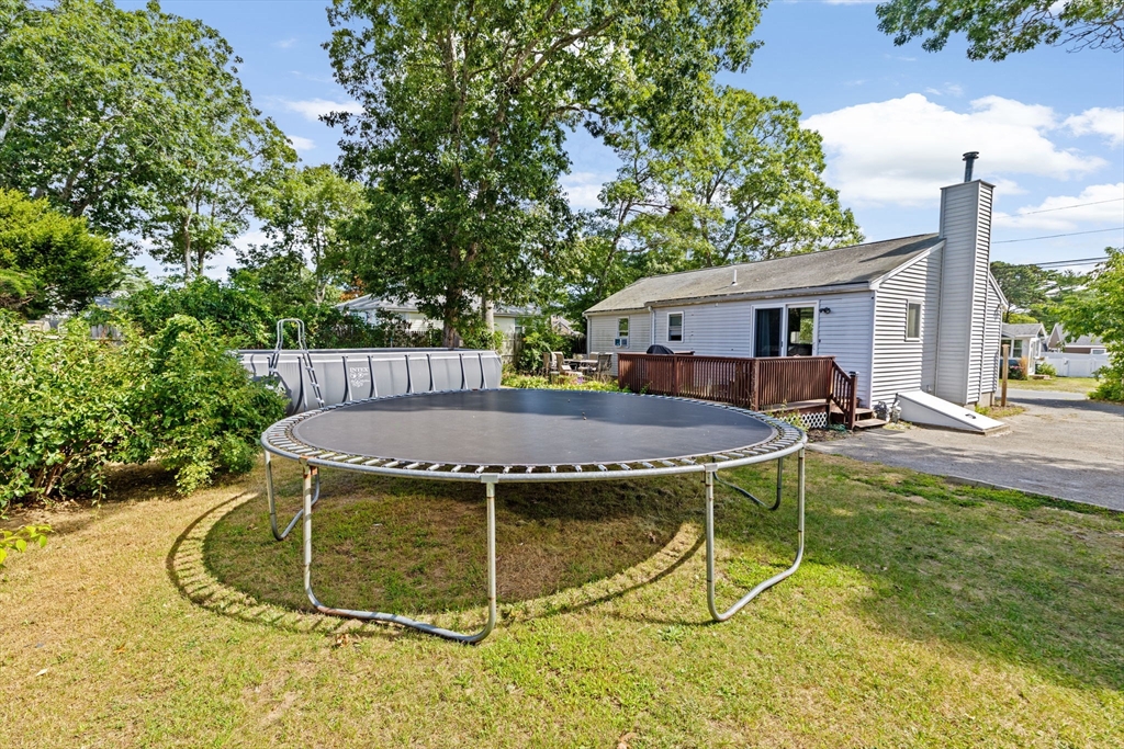 40 Cohasset Road Wareham, MA 02532 - Photo 23 of 42 a view of a house with backyard porch and sitting area