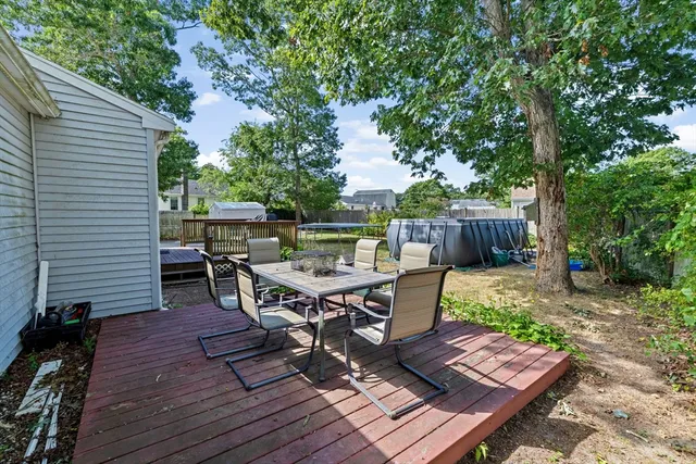a view of a dinning table and chairs in the patio