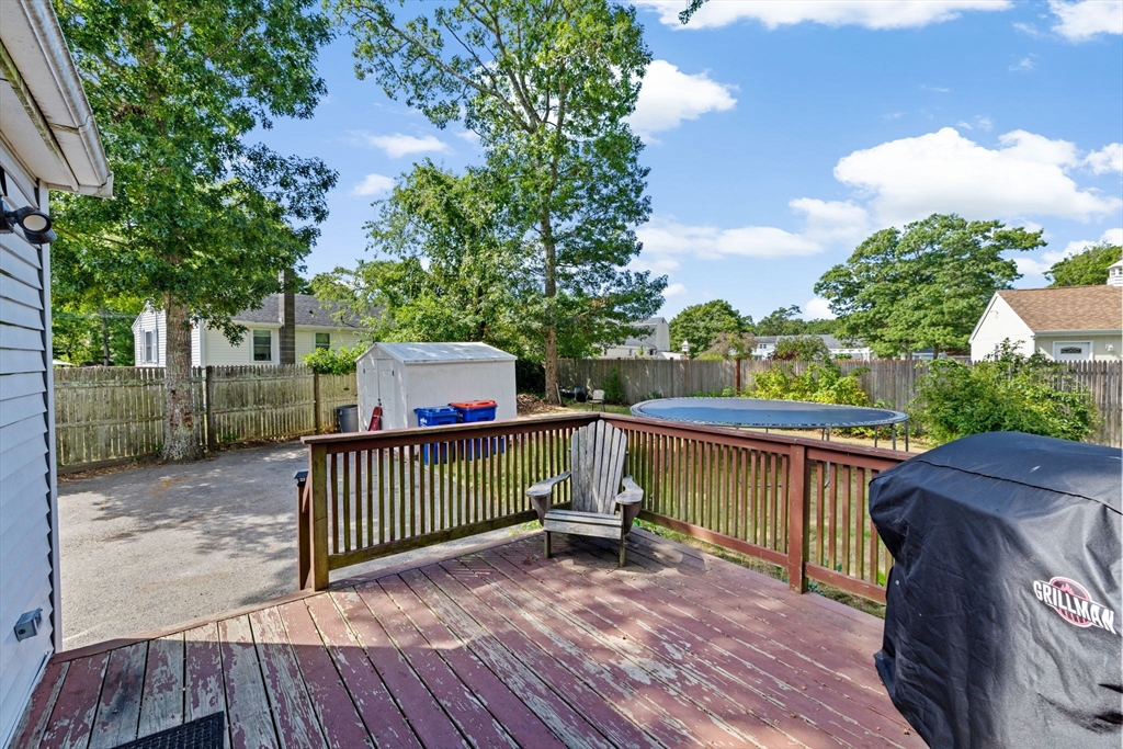 40 Cohasset Road Wareham, MA 02532 - Photo 29 of 42 a view of a deck with two chair and a table