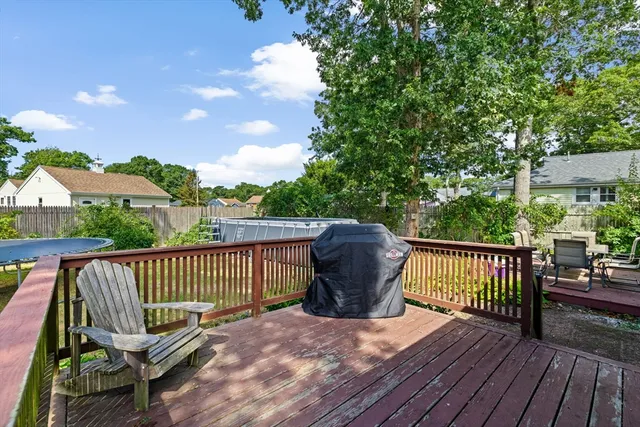 a view of a wooden deck with furniture