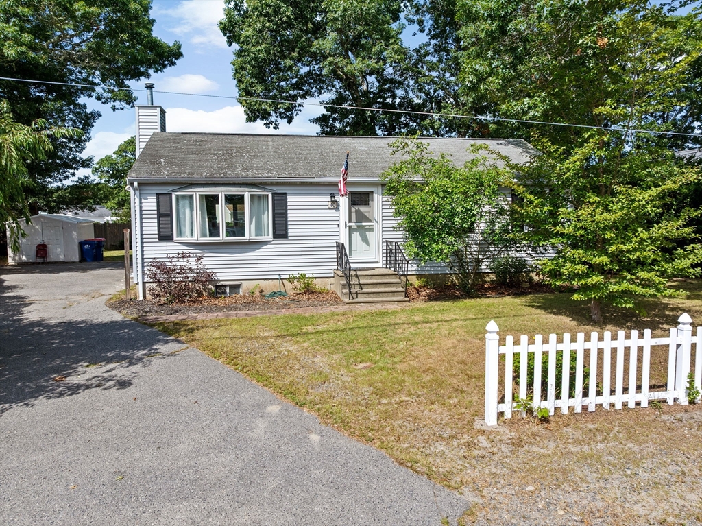 40 Cohasset Road Wareham, MA 02532 - Photo 32 of 42 a front view of a house with a yard