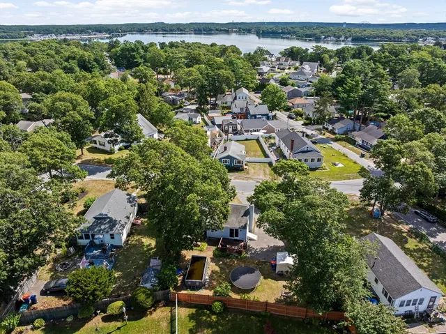 an aerial view of a house with a yard