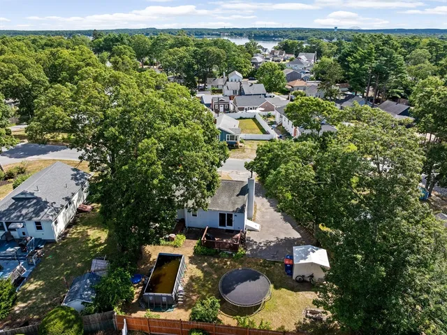 an aerial view of a house with outdoor space