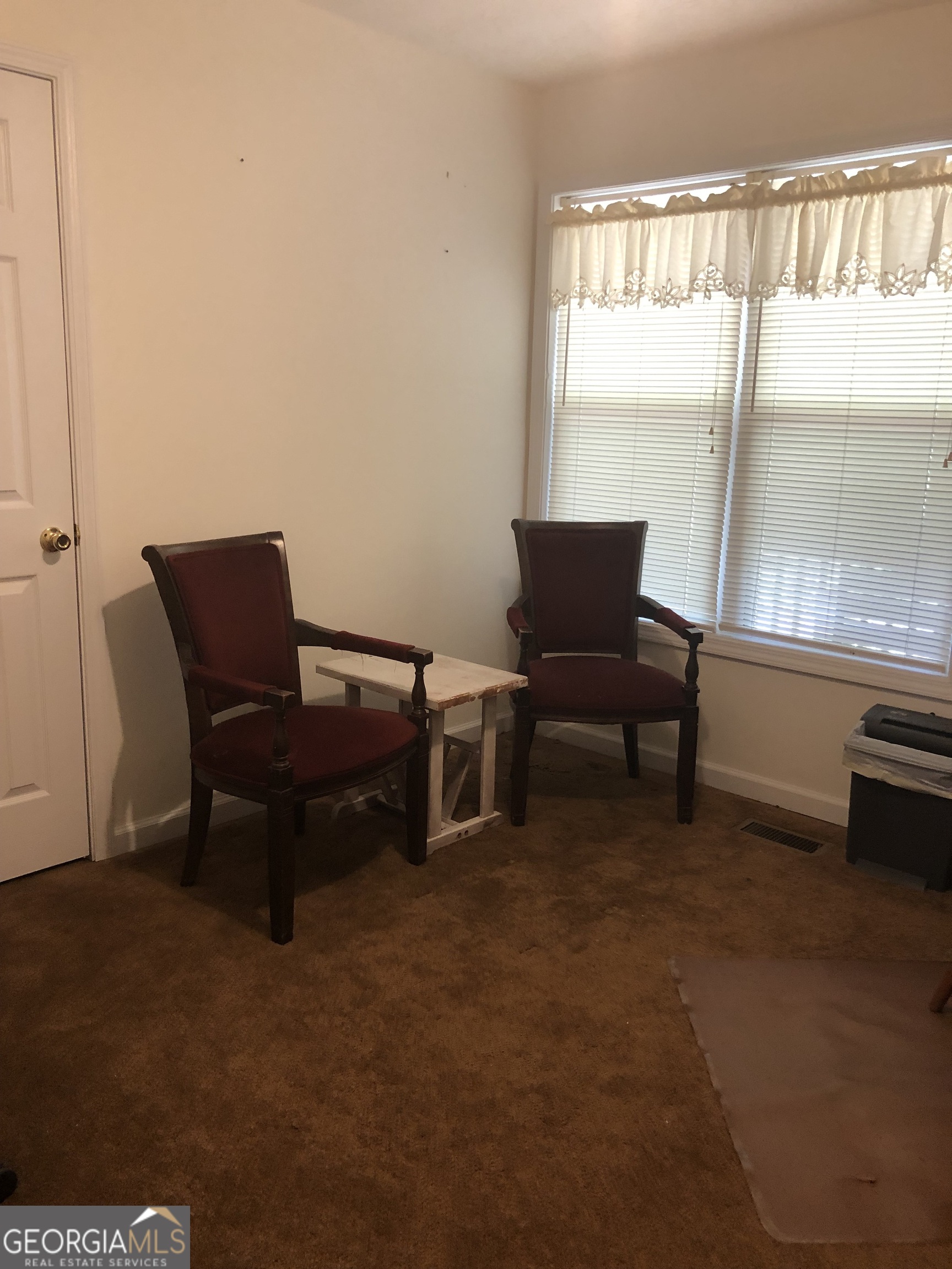 1744 Campbell Road Covington, GA 30014 - Photo 11 of 25 a living room with furniture and a large window