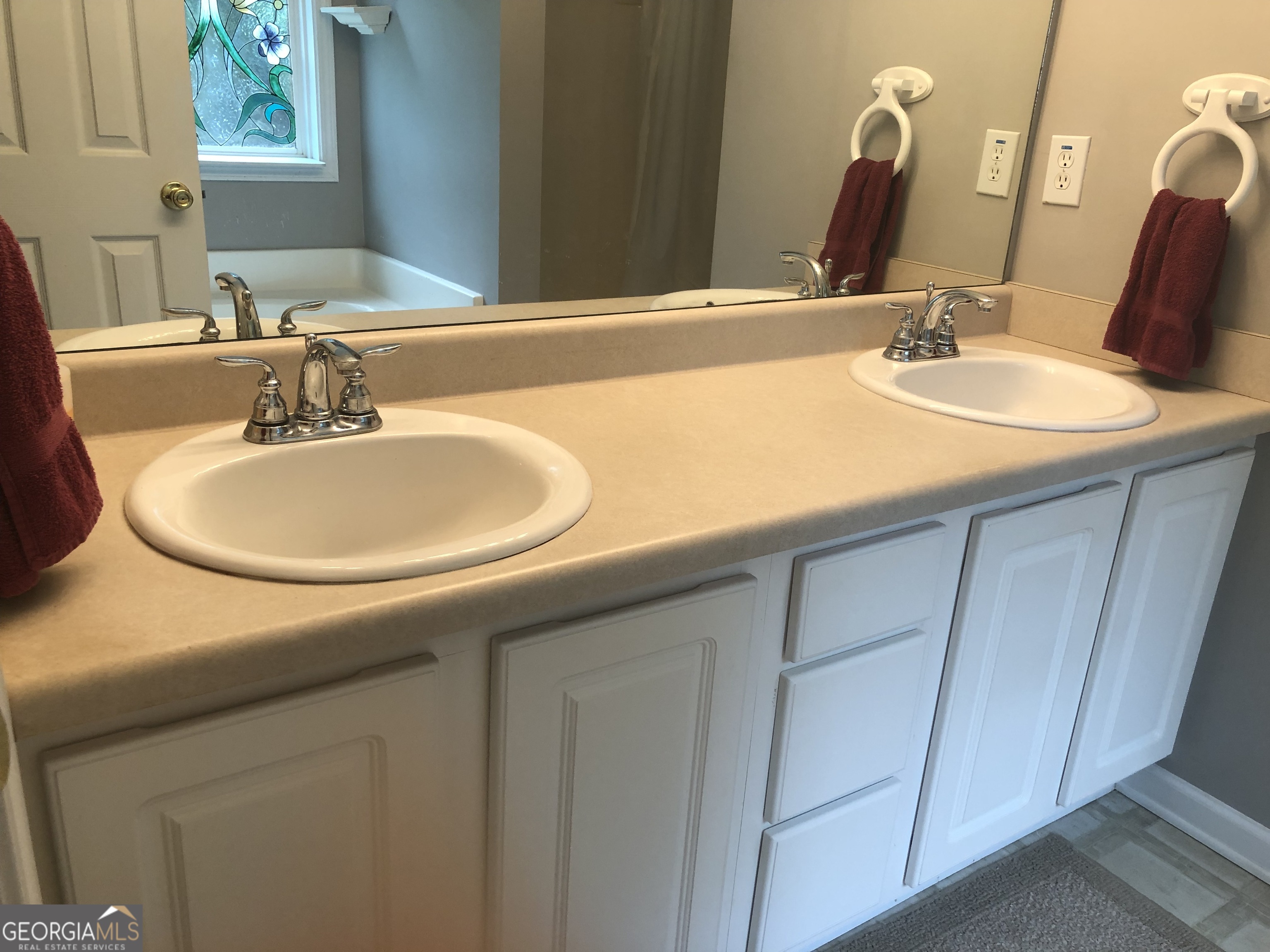 1744 Campbell Road Covington, GA 30014 - Photo 17 of 25 a bathroom with a sink and a mirror