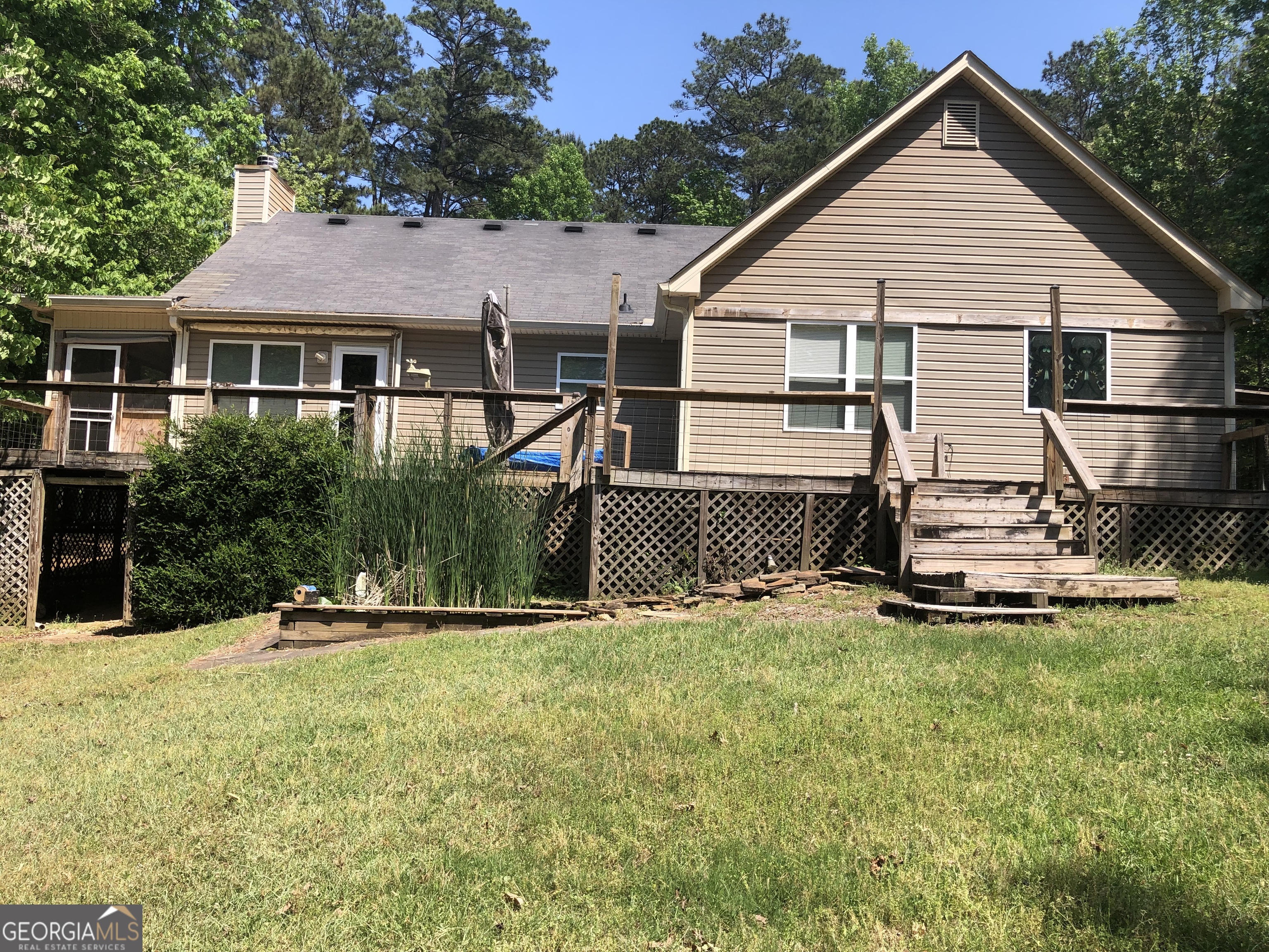 1744 Campbell Road Covington, GA 30014 - Photo 25 of 25 a view of a house with a yard and sitting area