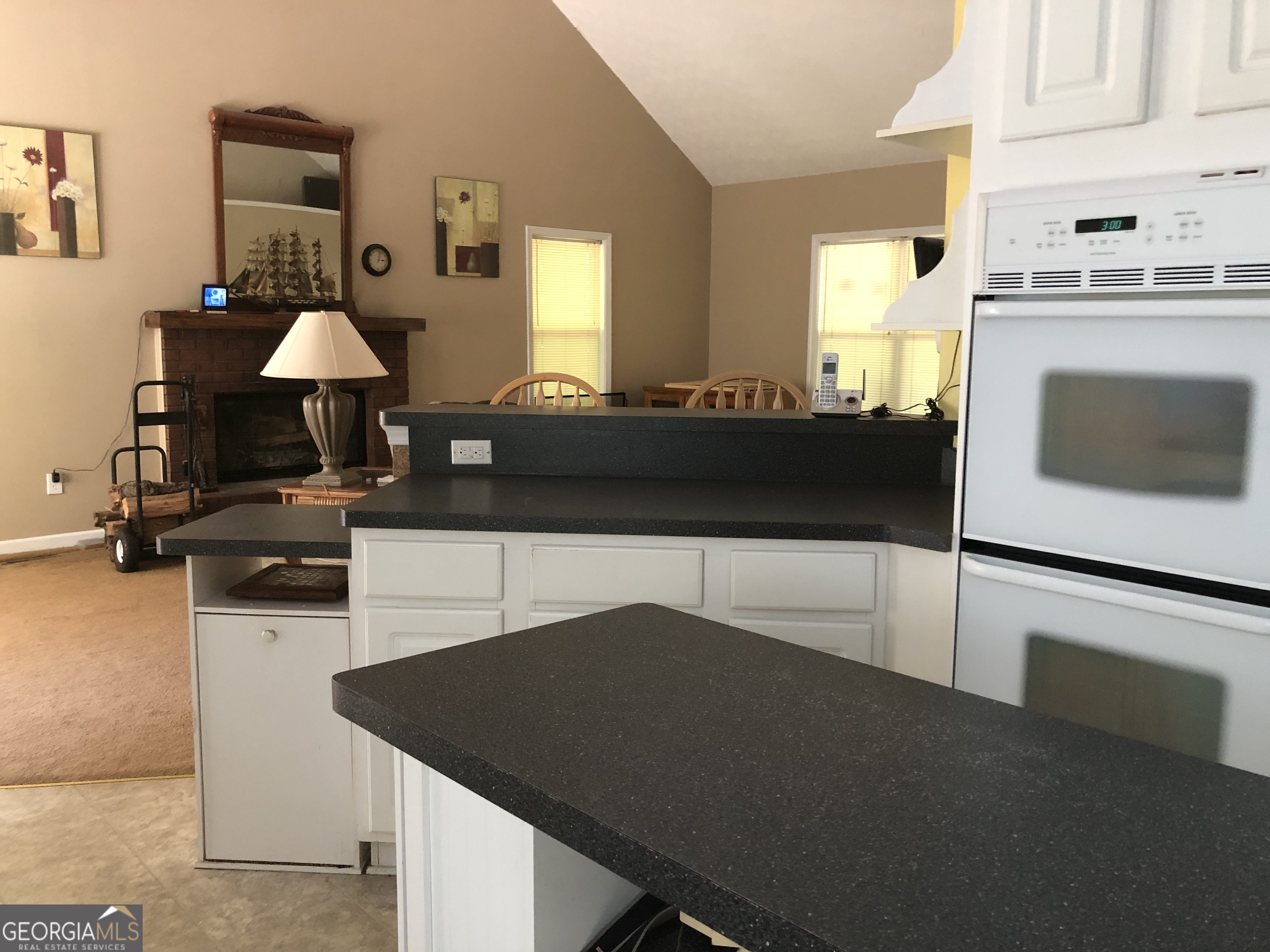 1744 Campbell Road Covington, GA 30014 - Photo 6 of 25 a kitchen with a sink dishwasher a stove and a refrigerator