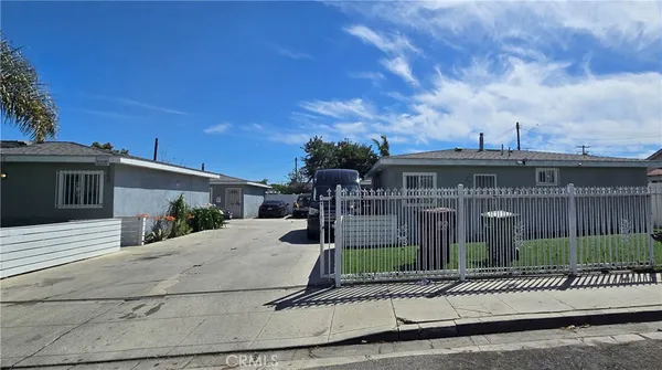 a view of a house next to a yard