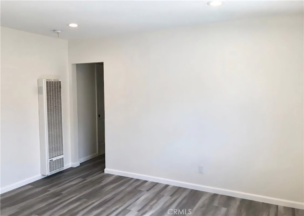 352 West Peach Street Compton, CA 90222 - Photo 7 of 9 a view of an empty room with wooden floor