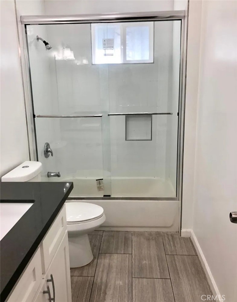 352 West Peach Street Compton, CA 90222 - Photo 8 of 9 a bathroom with a sink a toilet and shower