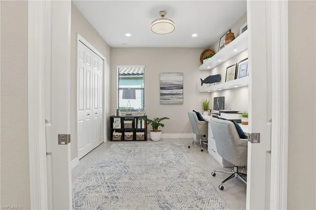 a large kitchen with kitchen island a sink dining table and chairs