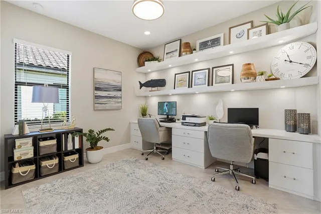 a bedroom with furniture and a window