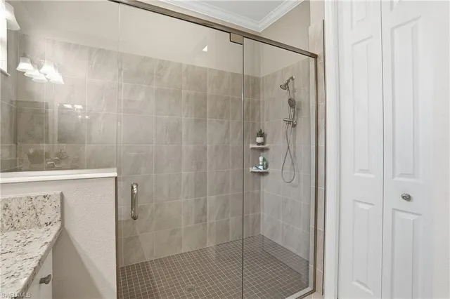a bathroom with a shower and a sink