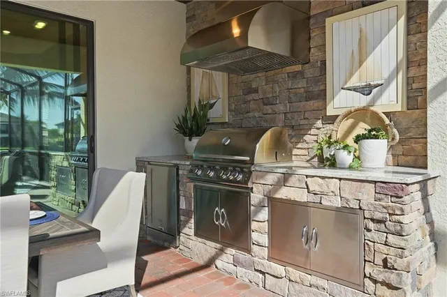 a living room with furniture a flat screen tv and a floor to ceiling window