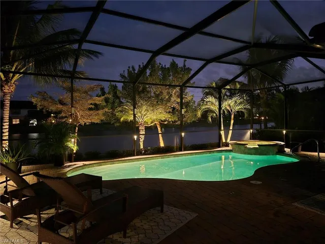 a view of a chairs and table in patio