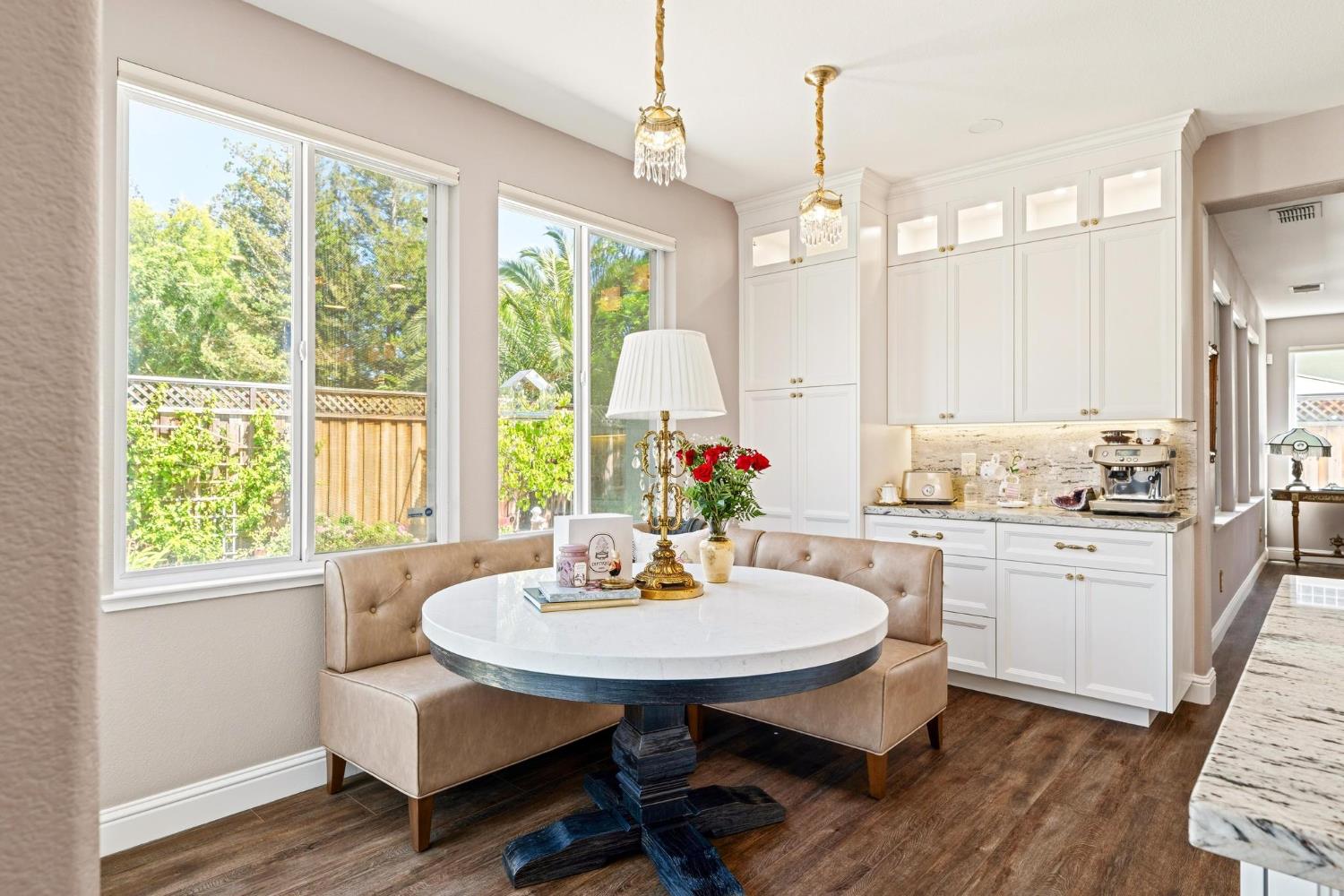 426 South Highland Avenue Ripon, CA 95366 - Photo 27 of 82 a kitchen with sink dining table and chairs