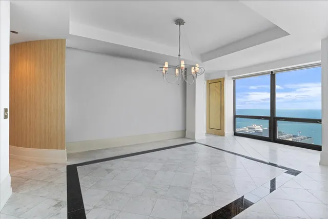 a kitchen with stainless steel appliances granite countertop a kitchen island a stove and a sink