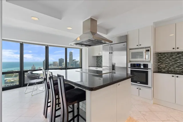 a room with furniture and a floor to ceiling window