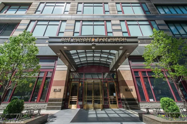 a view of a kitchen with a refrigerator and a window
