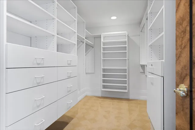 a view of an empty room and glass door