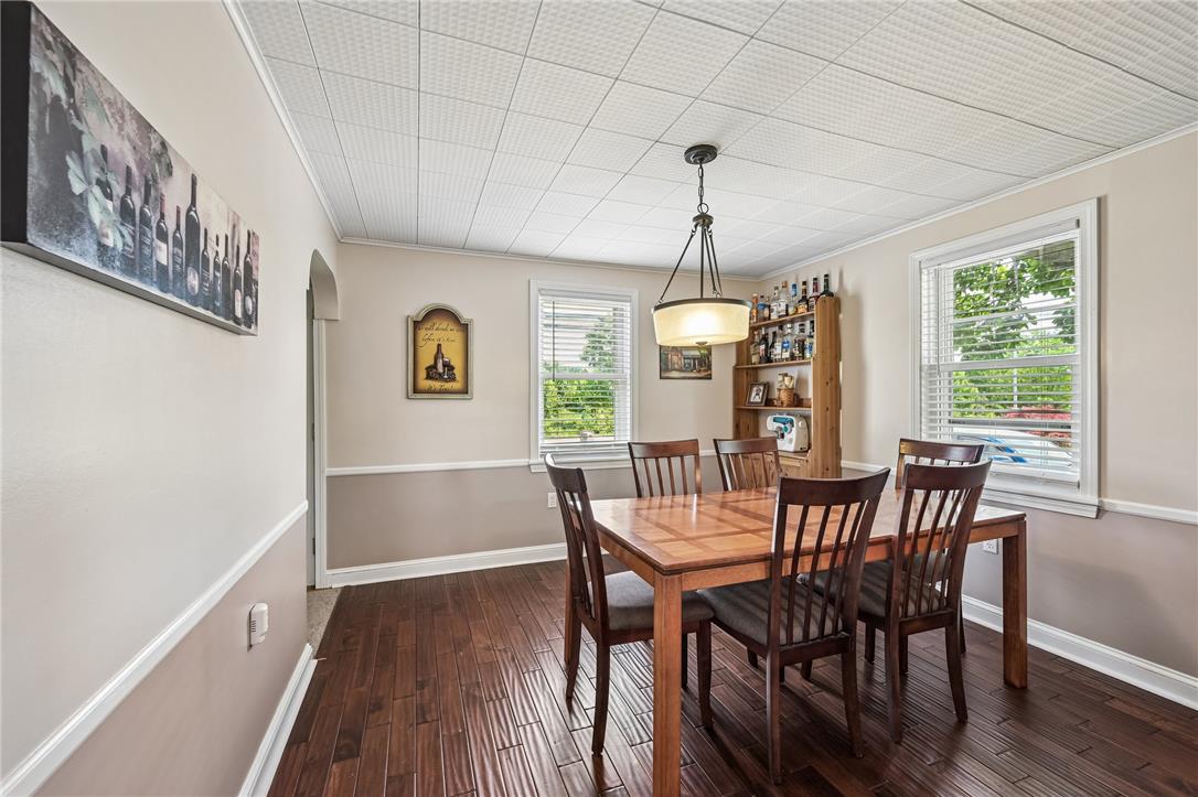 4065 Airport Road Allentown, PA 18109 - Photo 7 of 28 Rich hardwood floors complement this bright dining space, perfect for gatherings.